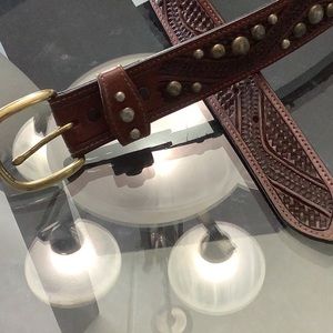 Brass studded leather belt.